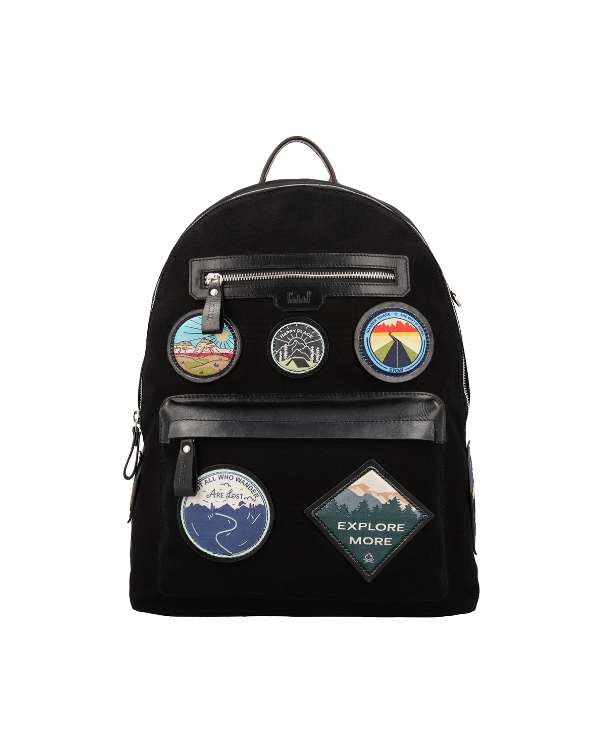 Black canvas and reclaimed leather backpack with travel-inspired embroidered leather patches, two zip pockets for a passport, iPad, earphones, and small accessories.