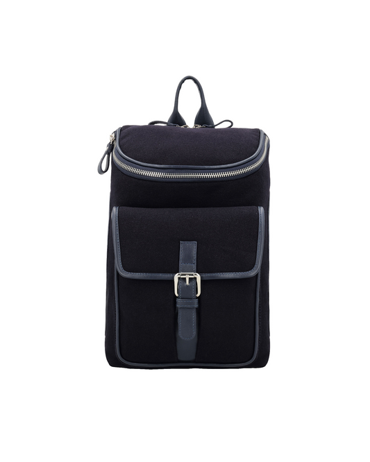navy canvas and reclaimed leather travel crossbody backpack for men with front zip compartment, magnetic flap closure, and buckle strap pocket.