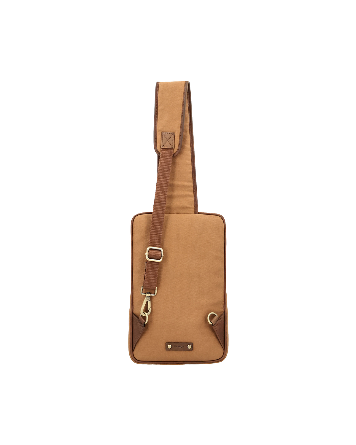 Tan canvas and reclaimed leather crossbody backpack for men with antique brass dog hook, padded shoulder pad, adjustable strap, and embossed leather logo patch.