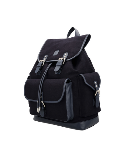 Navy canvas and reclaimed leather mini backpack with magnetic flap closure, Silver Nickle buckle loops, front pocket for a mobile phone, iPad sleeve, and single shoulder strap for everyday travel.