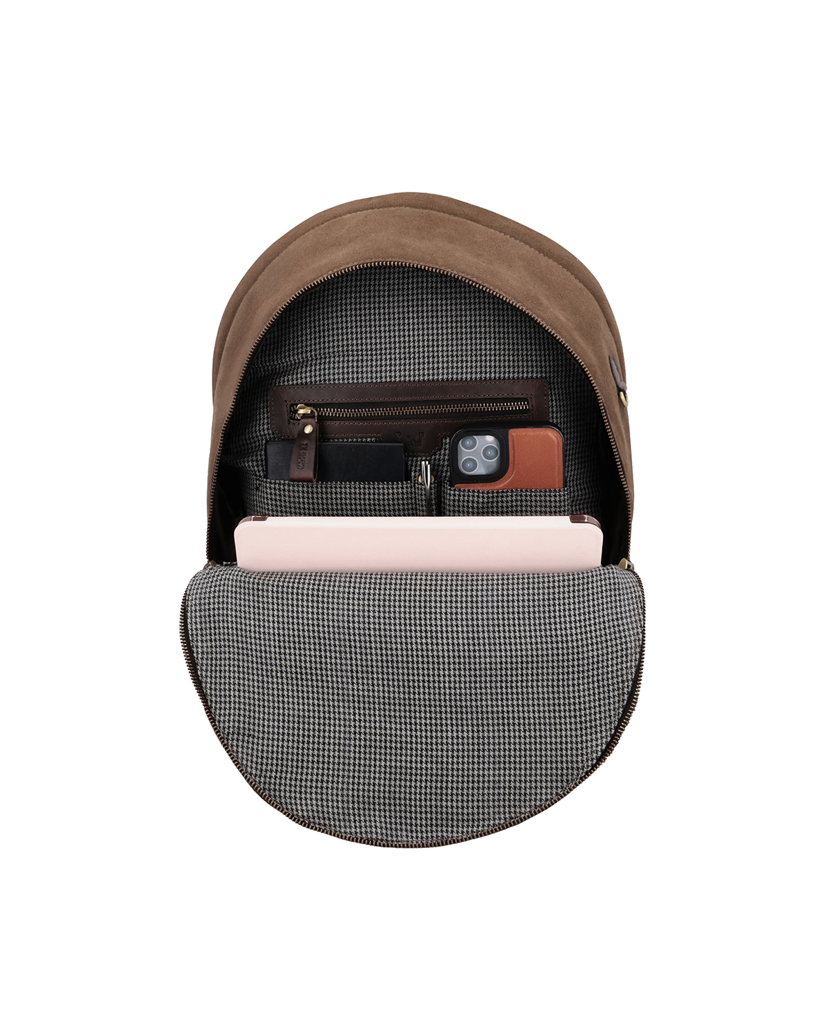 Brown canvas and reclaimed leather backpack with striped cotton lining, separate pockets for a phone, passport, pens, and a zip compartment.