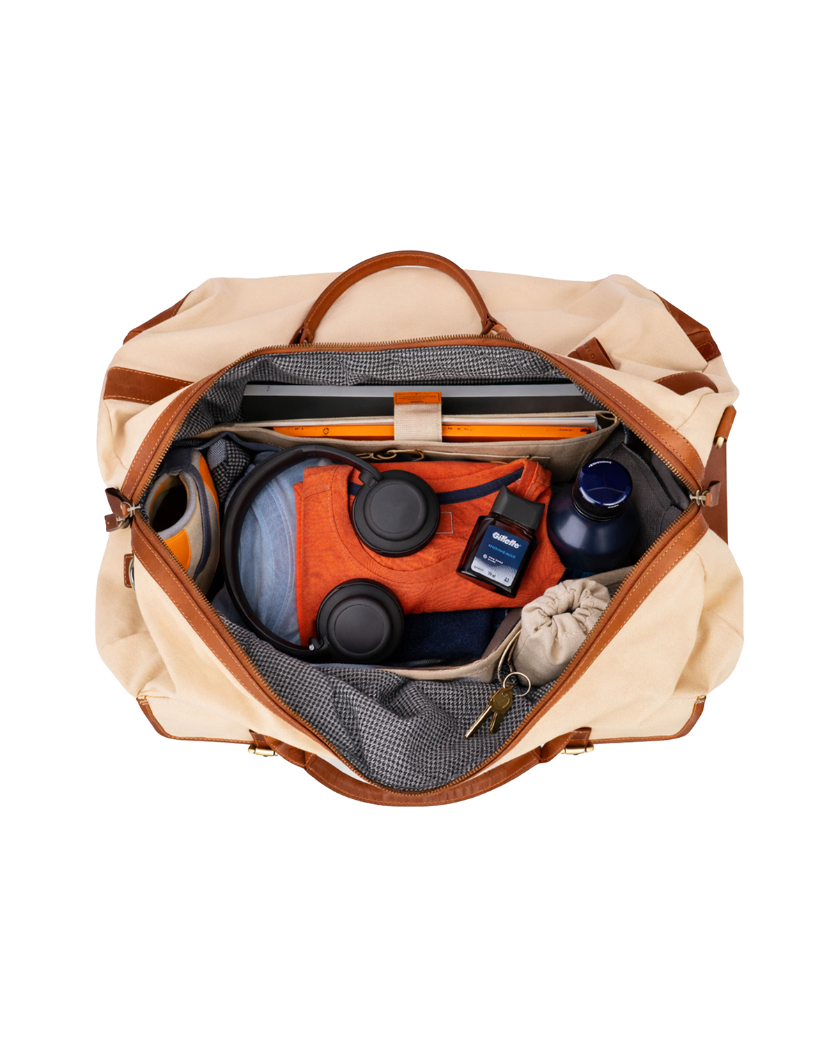 Open Rohtang Weekender cream beige canvas and reclaimed leather travel duffle bag with checked cotton lining, organized compartments, laptop sleeve, clothing, water bottle, and travel essentials.
