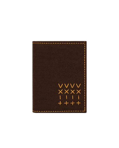 Brown canvas and leather passport cover for men with handcrafted embroidery details, designed as a premium travel accessory for carrying passports and essential documents. This compact passport holder from a premium leather bag brand of India makes a thoughtful gift for men, perfect for birthdays, anniversaries, and frequent travelers.