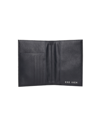 black leather passport cover featuring dedicated passport sleeves and card slots, designed for organized travel. This premium travel passport holder from a premium leather bag brand of India is ideal for carrying passports, cards, and travel essentials, and makes a thoughtful gift for men.