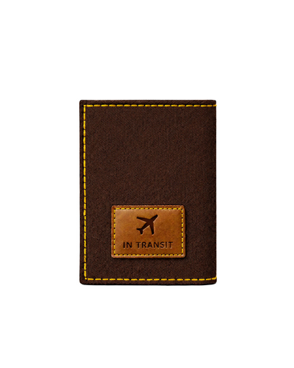 Brown canvas and leather passport cover for men featuring the "In Transit" travel patch, designed as a premium travel accessory for carrying passports and essential documents. This handcrafted passport holder from a premium leather bag brand of India makes a thoughtful gift for men, perfect for birthdays, anniversaries, and frequent travelers.