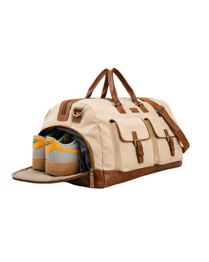 Studio Ek Inch Rohtang weekender duffle bag in natural canvas and reclaimed leather featuring a separate shoe compartment for clean packing. This premium holdall bag for men is designed for weekend getaways, airport travel and overnight trips by one of India's premium bag brands.