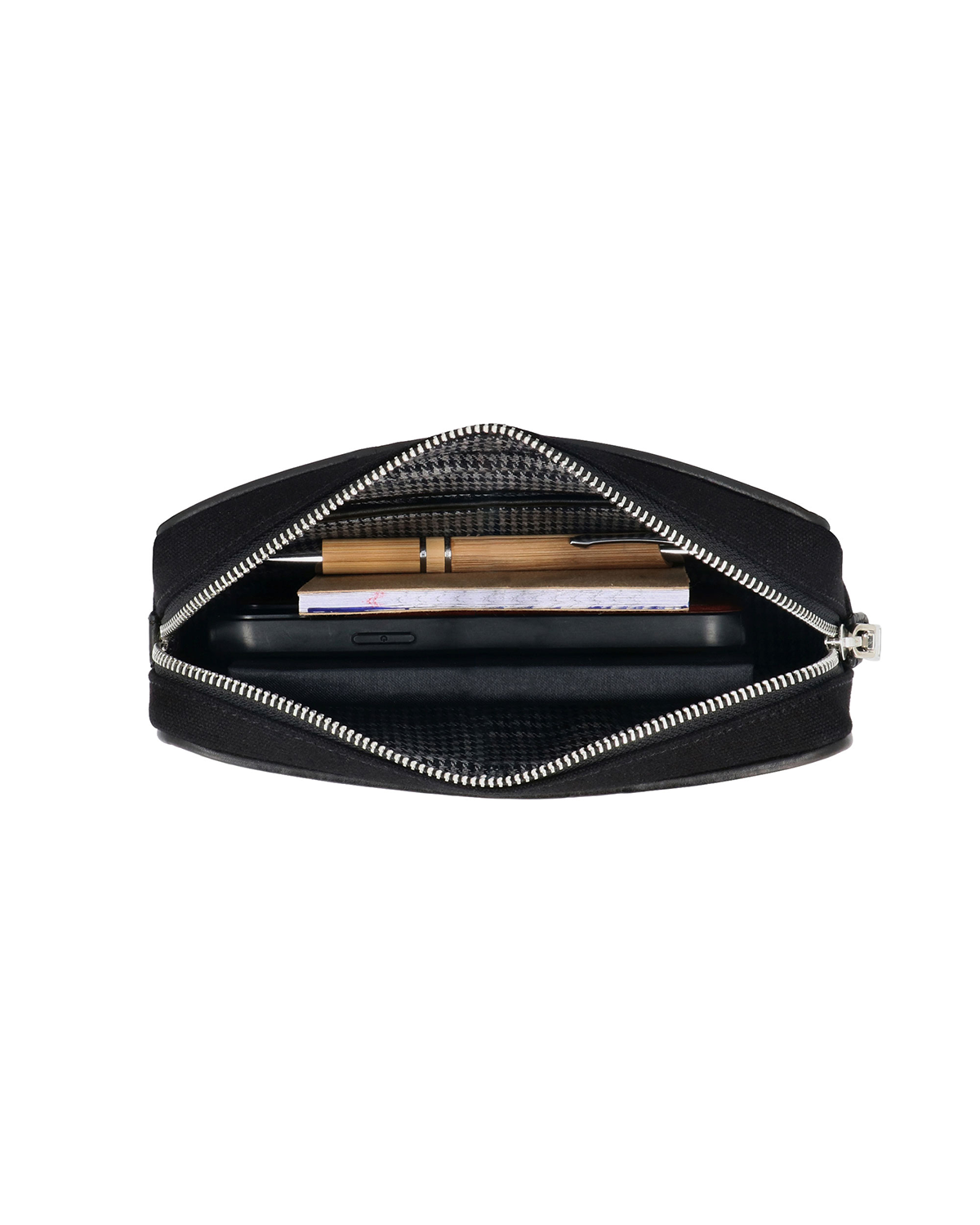Studio Ek Inch Metropolitan sling bag in black canvas and reclaimed leather featuring an adjustable shoulder strap and spacious compartments to carry a mobile phone, wallet, medicines and everyday essentials. Designed as a lightweight crossbody bag for modern travel and daily use.