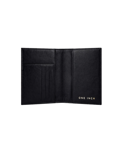 Inside view of a black leather passport cover featuring dedicated card slots and compartments for passports and travel documents. This premium travel passport holder from a premium leather bag brand of India is designed for organized travel and makes a thoughtful gift for men, ideal for birthdays, anniversaries, and frequent travelers.