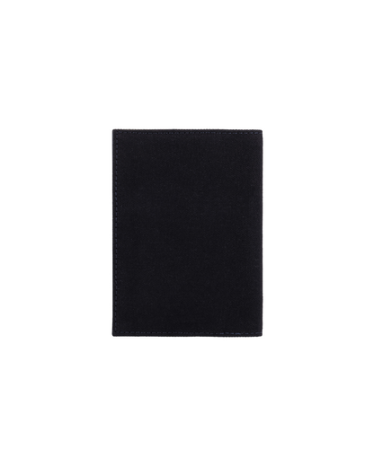 Minimalist black canvas and leather passport cover for men, designed to keep passports and travel documents secure in a slim and elegant profile. Crafted by a premium brand of leather wallets & passport cover in India, this luxury travel accessory is perfect for frequent travelers and makes a thoughtful birthday gift, anniversary gift, or festive gift for him.