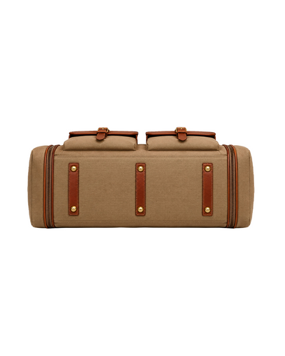 Bottom view of the Studio Ek Inch Ladakh expandable canvas and leather duffle bag, featuring reinforced leather strips, brass studs and a durable base designed for frequent travel. This premium weekender holdall bag is crafted for airport journeys, road trips and overnight stays by one of India's premium bag brands.