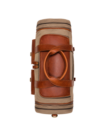 Top view of the Studio Ek Inch Ladakh expandable canvas and leather duffle bag, showcasing premium leather handles, reinforced base and expandable compartments. This premium travel holdall bag is designed for weekend getaways, airport travel and long journeys by one of India's premium bag brands.
