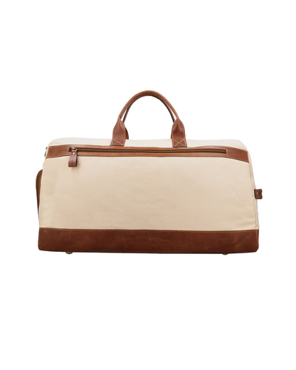 Studio Ek Inch Rohtang weekender duffle bag in natural canvas and reclaimed leather, featuring a spacious zip pocket for quick access to travel essentials. This premium canvas and leather holdall bag is designed for weekend getaways, airport travel and overnight trips by one of India's premium bag brands.