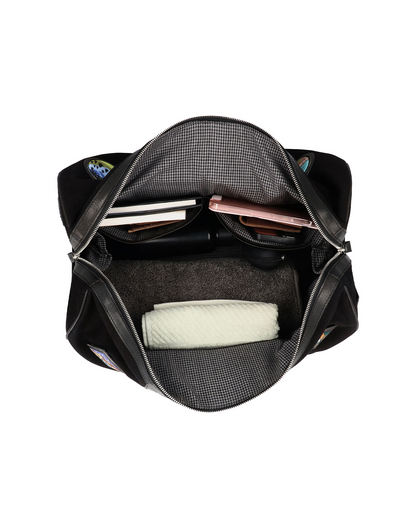 Top view of the Studio Ek Inch Kasol Weekender duffle bag in canvas and reclaimed leather, showcasing its spacious main compartment with dedicated space for clothes, books and travel essentials. Designed as a premium weekender bag for men, it is ideal for overnight stays, airport travel and weekend getaways.