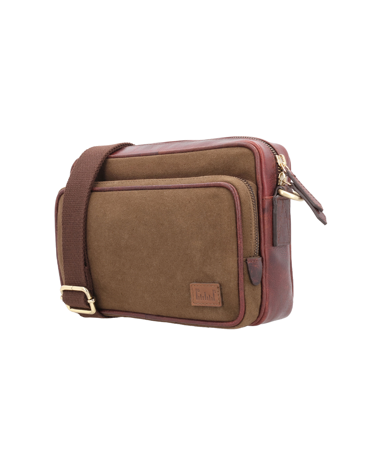 studio Ek Inch Metropolitan Sling crossbody bag crafted from waterproof canvas and reclaimed leather with multiple compartments for carrying a phone, wallet and everyday essentials. A premium sling bag designed for modern travel and daily movement.