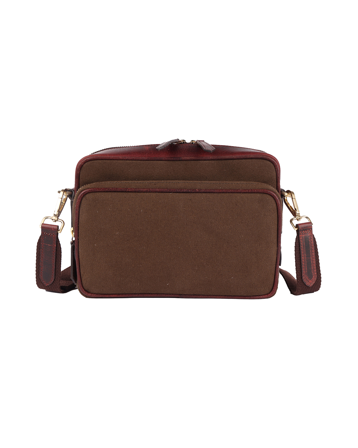 Front view of the Studio Ek Inch Metropolitan Sling bag in brown waterproof canvas and reclaimed leather, featuring a spacious zip pocket, adjustable shoulder strap and antique brass hardware. Designed as a premium crossbody bag for travel and everyday use, it offers practical storage with timeless craftsmanship.