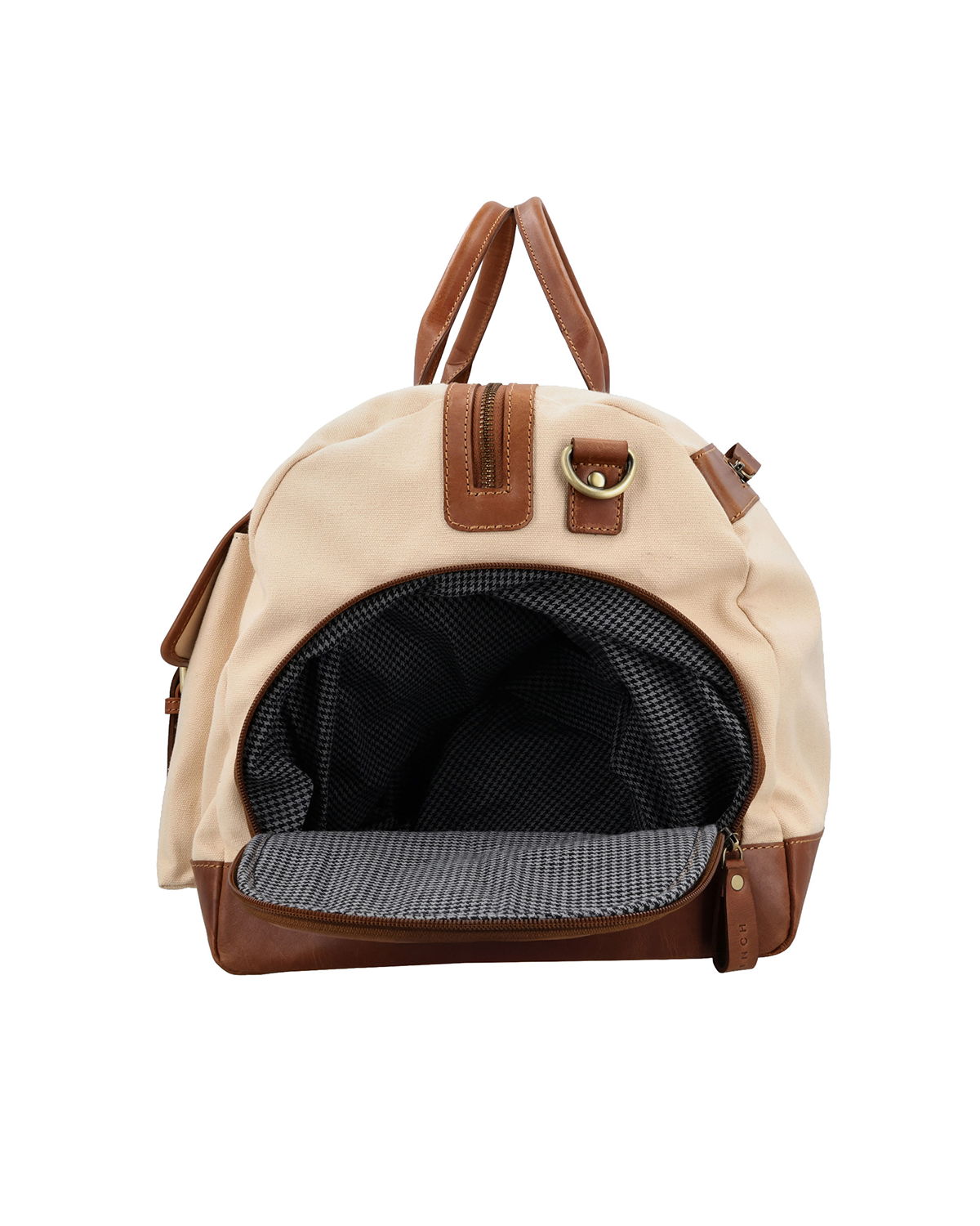 Side compartment view of the Studio Ek Inch Rohtang Weekender duffle bag in canvas and reclaimed leather, featuring a dedicated shoe compartment that keeps footwear separate from clothes and travel essentials. Designed as a premium weekender bag for men, it offers organized storage for weekend getaways, airport travel and overnight trips.