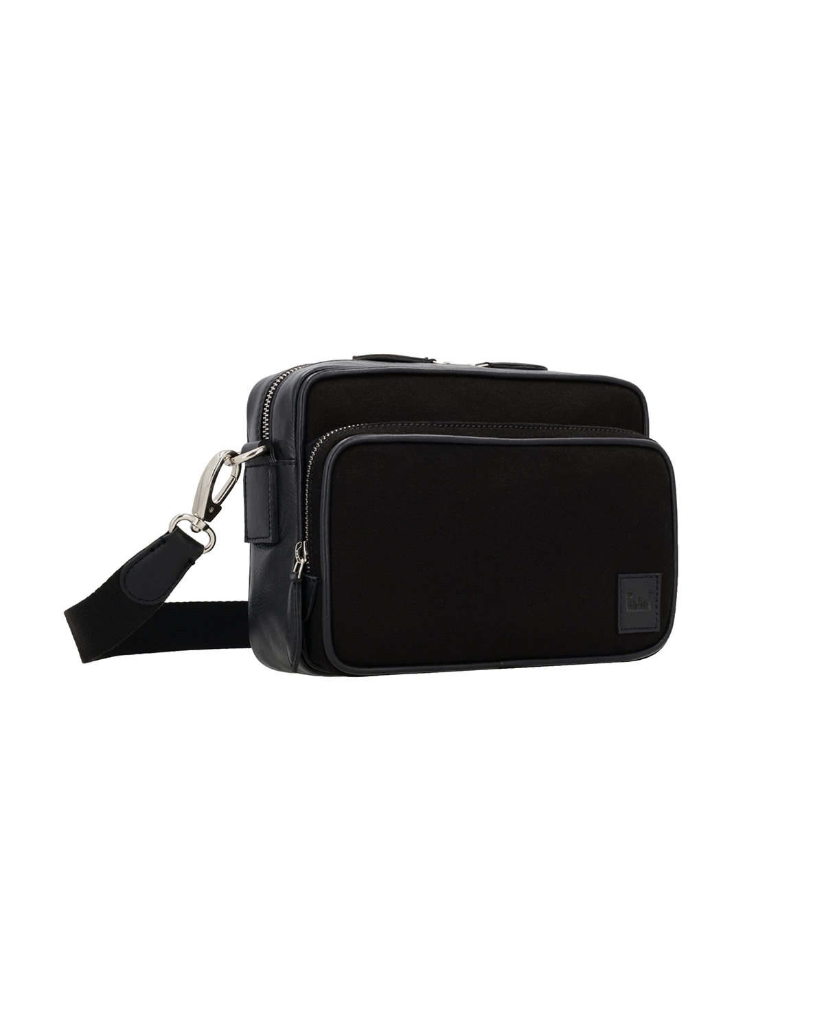 Studio Ek Inch Metropolitan canvas leather premium sling bag in black with spacious zip compartments and premium hardware. A handcrafted crossbody bag for men designed for work, travel and everyday journeys.