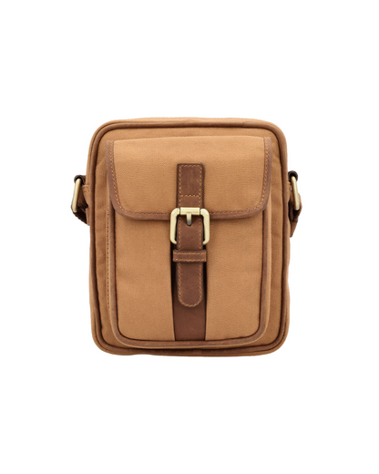 Studio Ek Inch River Sling bag in tan waterproof canvas and reclaimed leather featuring a front utility pocket, buckle closure and adjustable strap. Designed as a minimalist travel crossbody bag for men, it offers organized space for a mobile phone, wallet and everyday essentials. premium crossbody bag brand of india