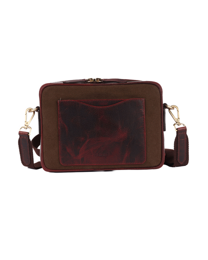 Back view of the Studio Ek Inch Metropolitan Sling bag in brown waterproof canvas and reclaimed leather, featuring a rear slip pocket for quick access to a phone, passport or everyday essentials. Designed as a premium crossbody bag for travel and daily use with functional storage and timeless craftsmanship.